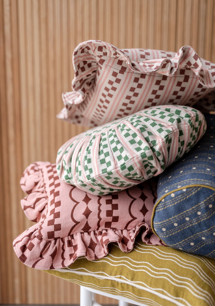 TBCo Cotton Cushion Cover in Pink Stripe with ruffled edge and checkerboard pattern, displayed with other patterned cushions