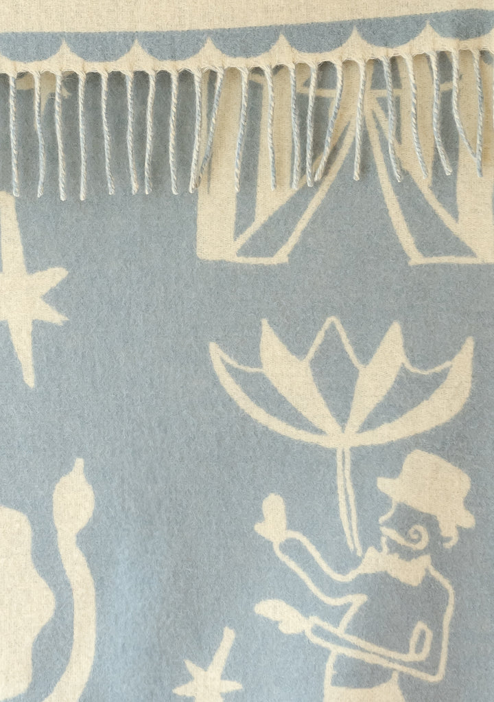 TBCo Lambswool Baby Blanket in Circus Jacquard with soft blue and buttermilk yellow playful design and fringed edges