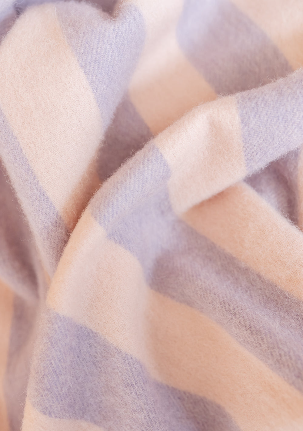 Close-up of soft TBCo Lambswool Baby Blanket in Pink & Lilac Stripe showing delicate fibres and classic striped design