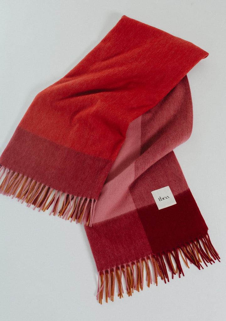 TBCo Lambswool Blanket in Berry Frame Check with soft wool and fringed edges in rich red and pink tones