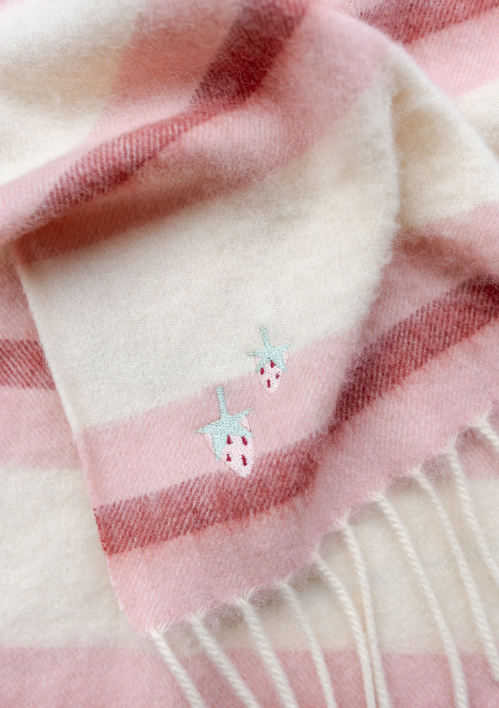 TBCo Lambswool Baby Blanket in Pink Stripe with embroidered sun and moon detail, featuring soft pink and cream stripes and fringed edges