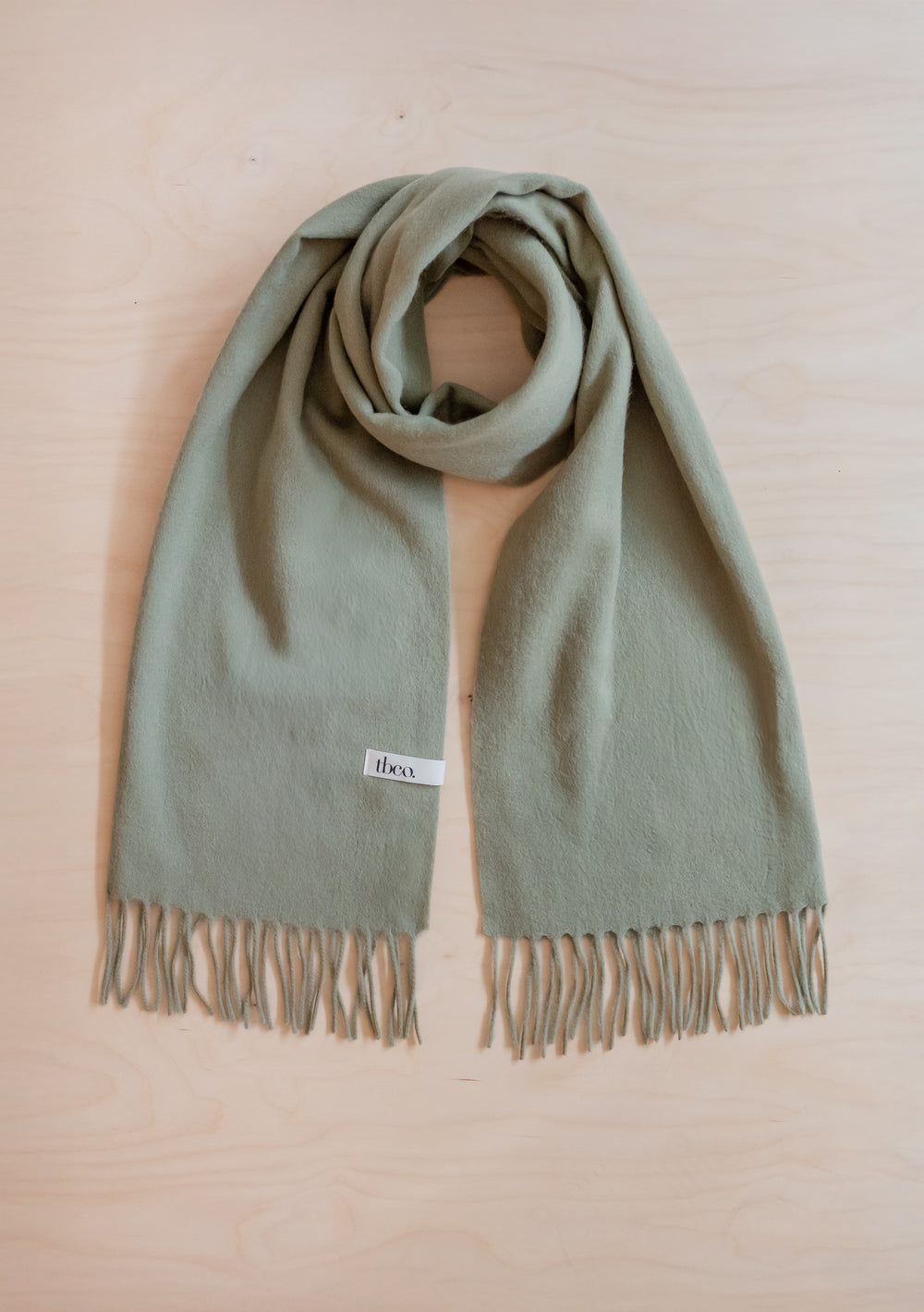 Lambswool Oversized Scarf in Olive by TBCo featuring soft lambswool with fringed edges for warmth and style