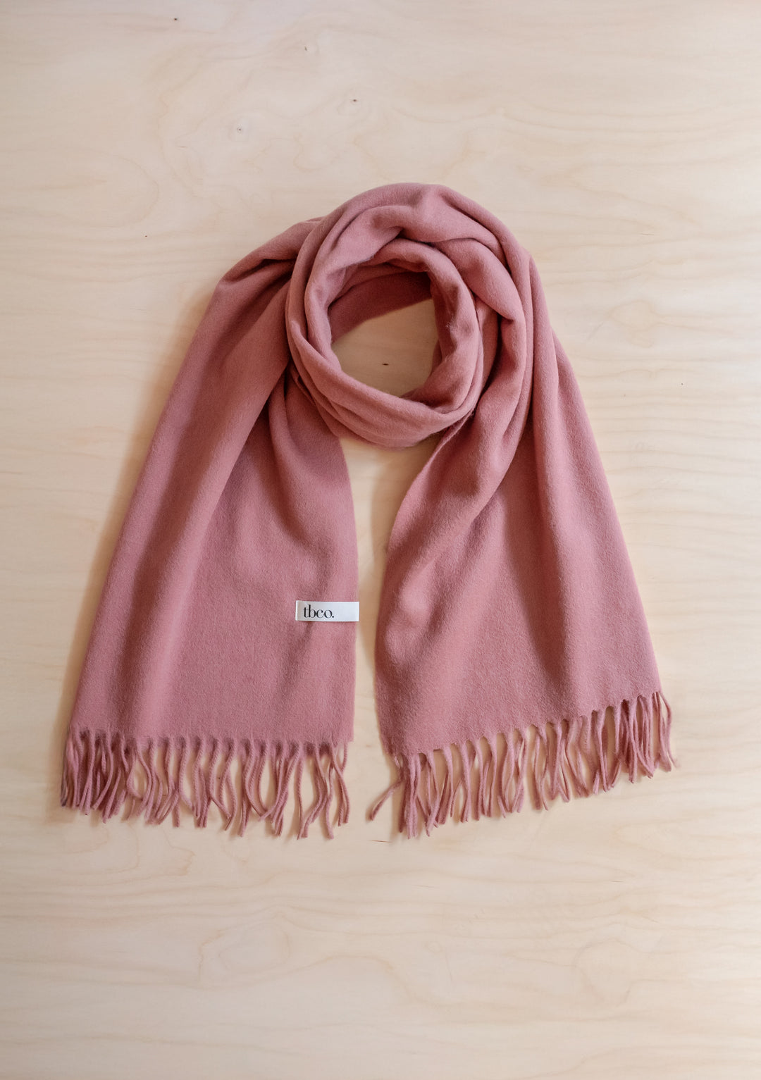 Soft Lambswool Blanket Scarf in Blush with fringed edge by TBCo, designed for comfort and warmth