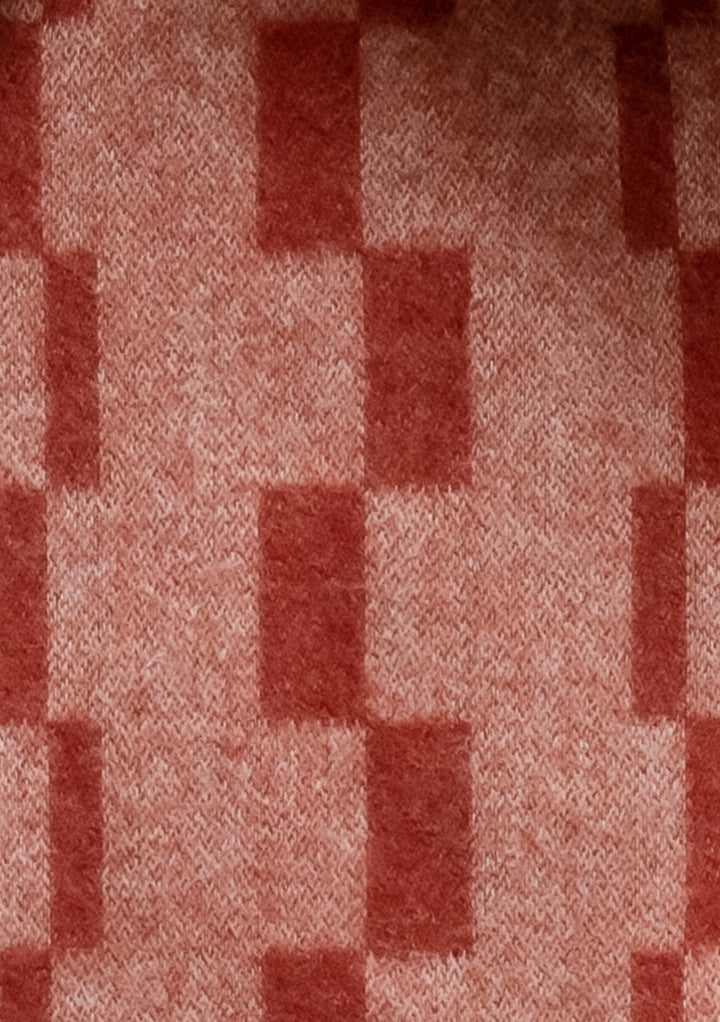 TBCo Lambswool Oversized Scarf in Neutral Checker featuring a rust and red stacked checkerboard pattern close-up texture detail