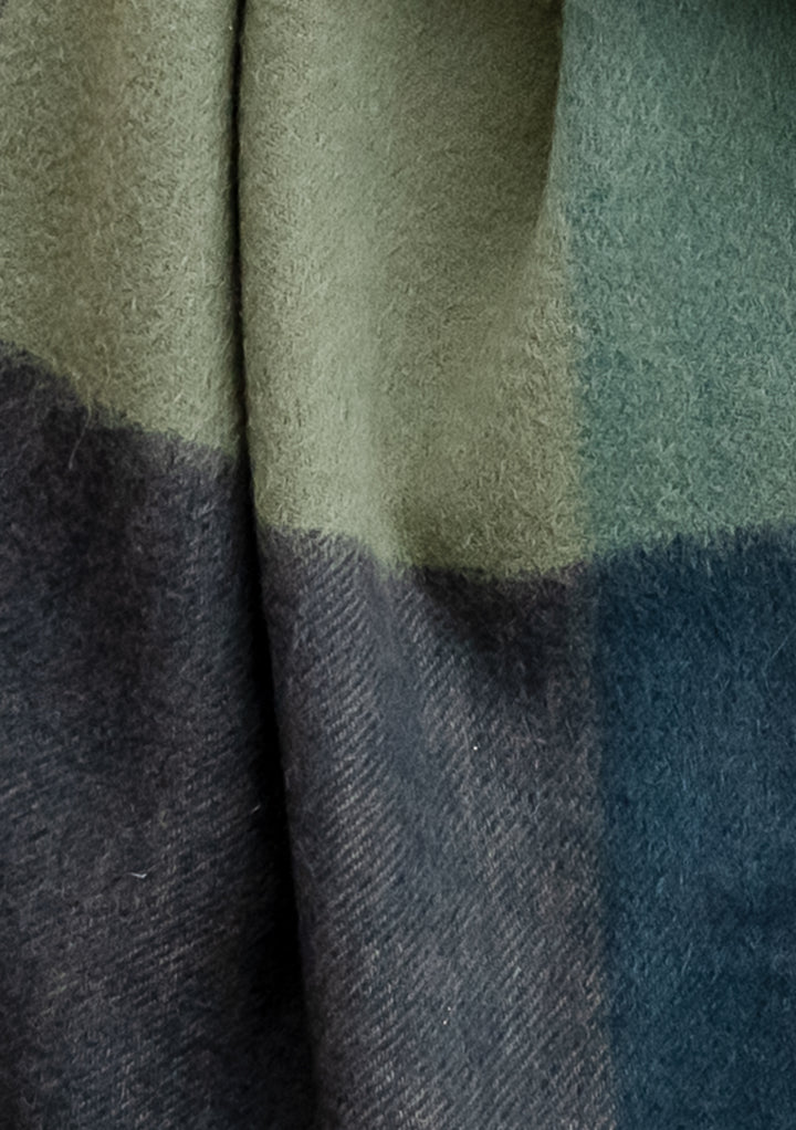 TBCo Lambswool Oversized Scarf in Green Edge Check featuring sage and forest green tones with charcoal grey herringbone pattern