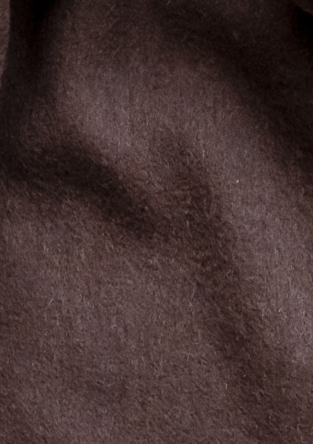 Close-up texture of TBCo Lambswool Oversized Scarf in Chocolate showing rich brown wool fabric with soft, luxurious finish