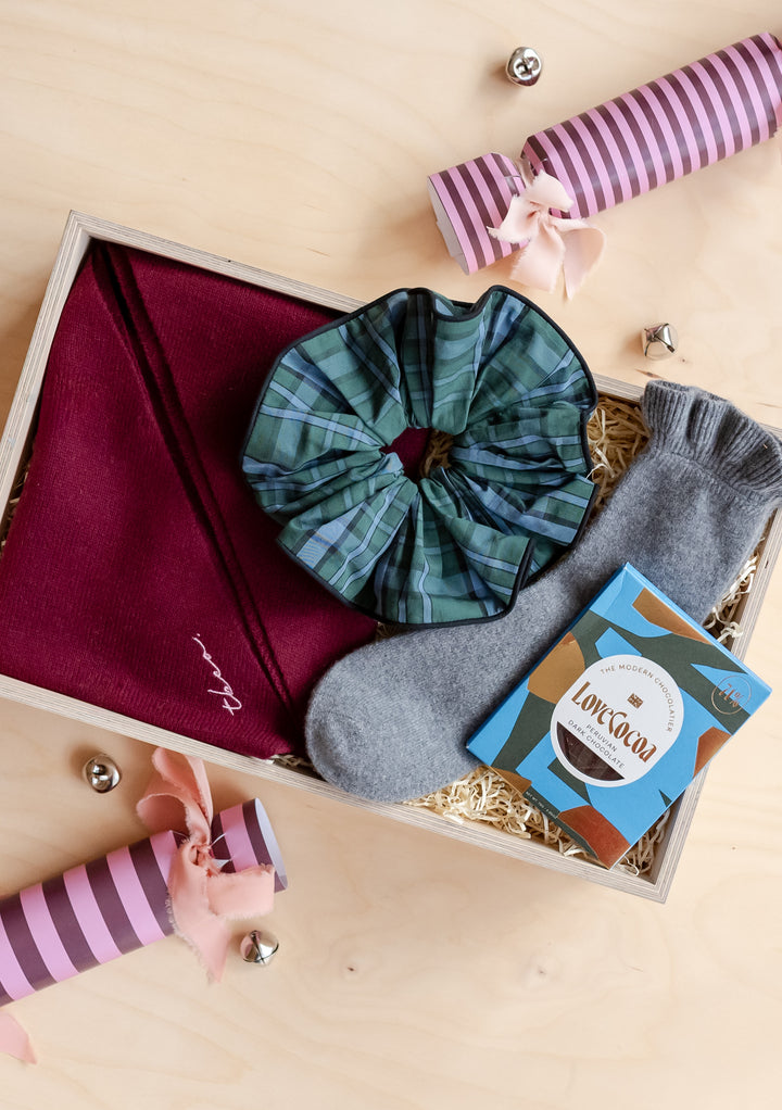 TBCo Accessories Gift Box featuring cosy socks, tartan scrunchie, scarf, and luxury hot chocolate in a gift-ready presentation