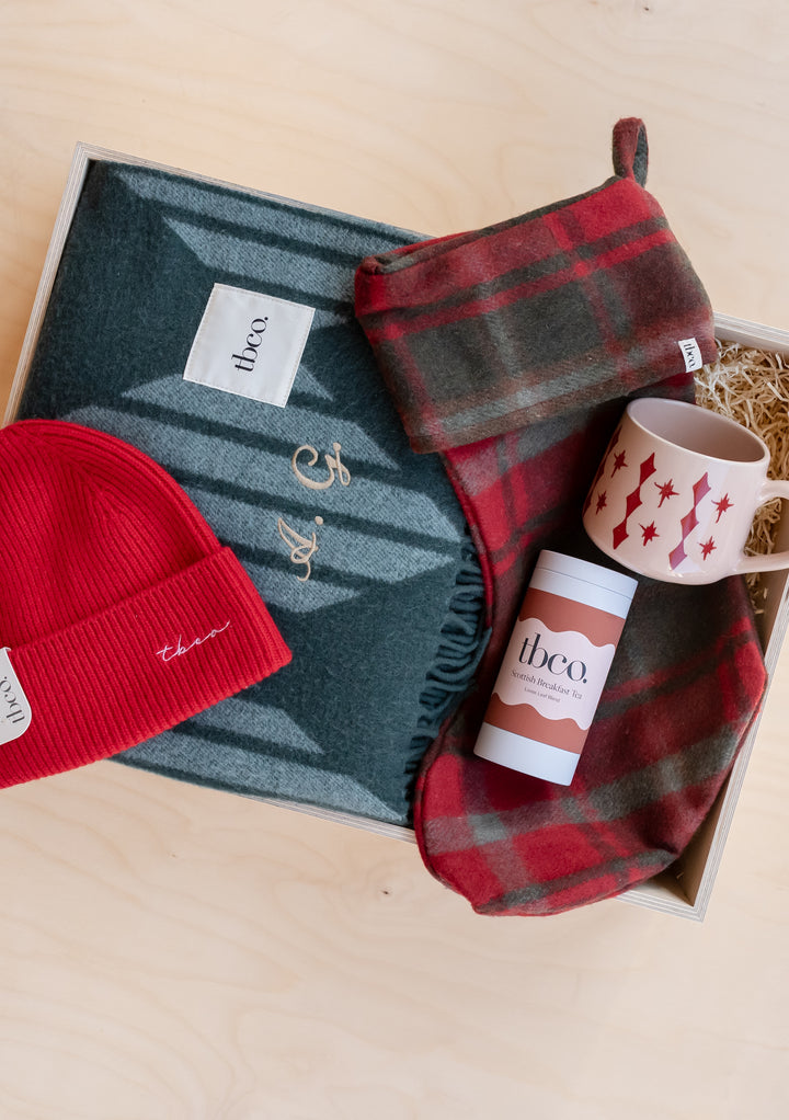 TBCo Build Your Own Christmas Gift Box with personalised blanket, scarf, beanie, mug, and festive accessories.