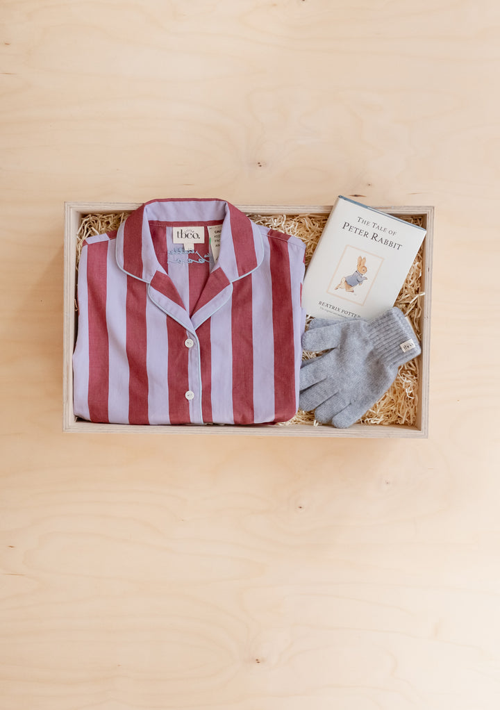 TBCo Kids Gift Box with striped pyjamas, Peter Rabbit book, and grey knitted gloves in a wooden box on straw filling