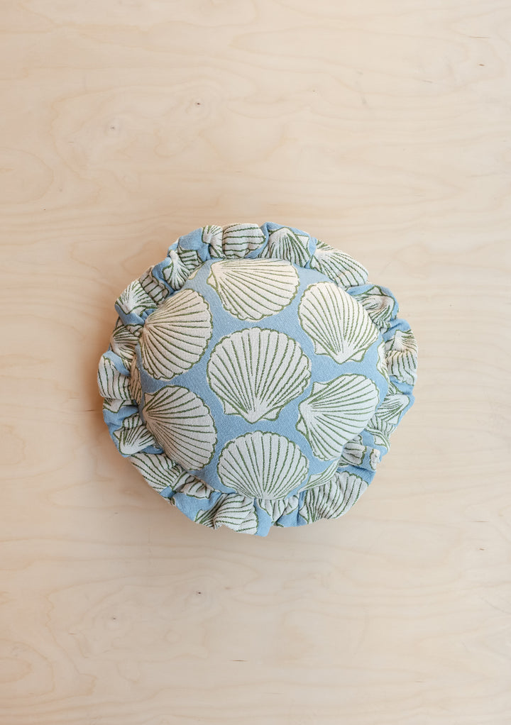 Portrait view of TBCo Cotton Cushion Cover in Blue Shell featuring soft round shape and delicate ruffled edge, gallery position 1.