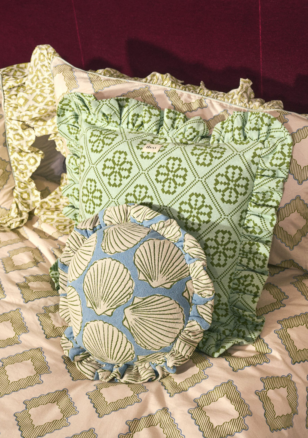 Cotton Cushion Cover in Blue Shell by TBCo with ruffled edges and seashell motifs on soft blue fabric