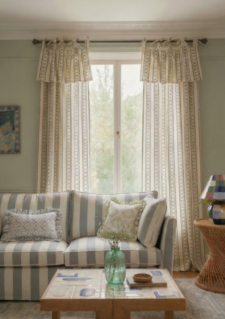 Elegant living room showcasing TBCo Pair of Cotton Tie-Top Curtains in Navy Ditsy Floral with soft natural light.