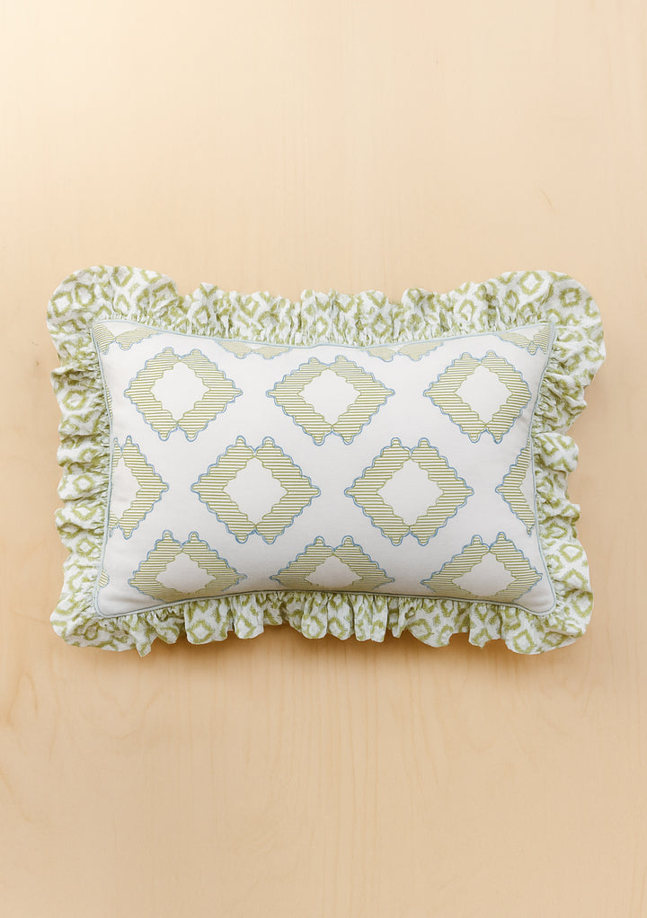 Pair of Cotton Pillowcases in Green Diamond by TBCo featuring ruffled edges and geometric green diamond pattern on pale background