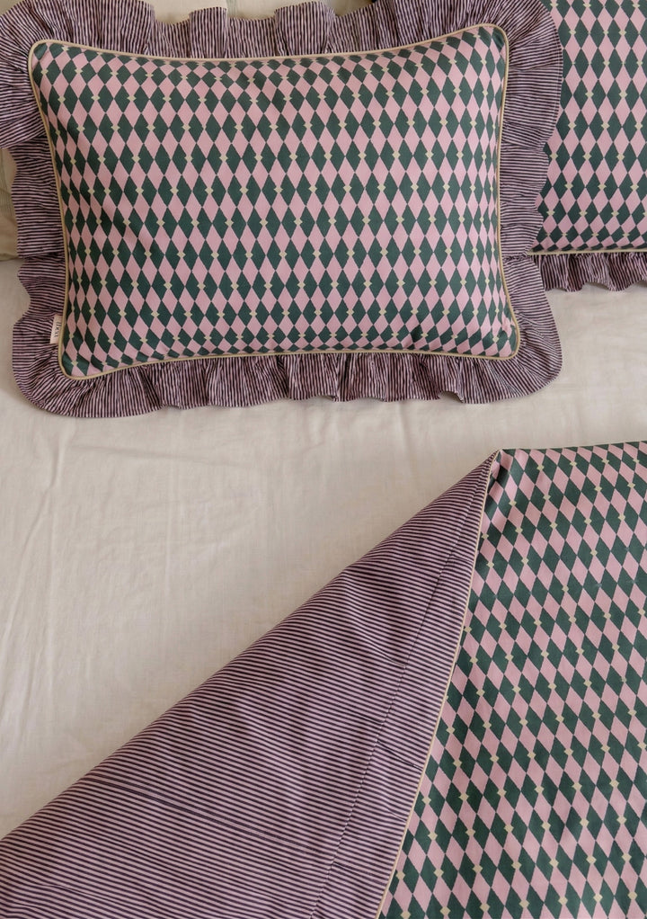 Cotton Duvet Cover & Pillowcases Set in Pink Harlequin by TBCo with pink and green diamond print and striped ruffled edges