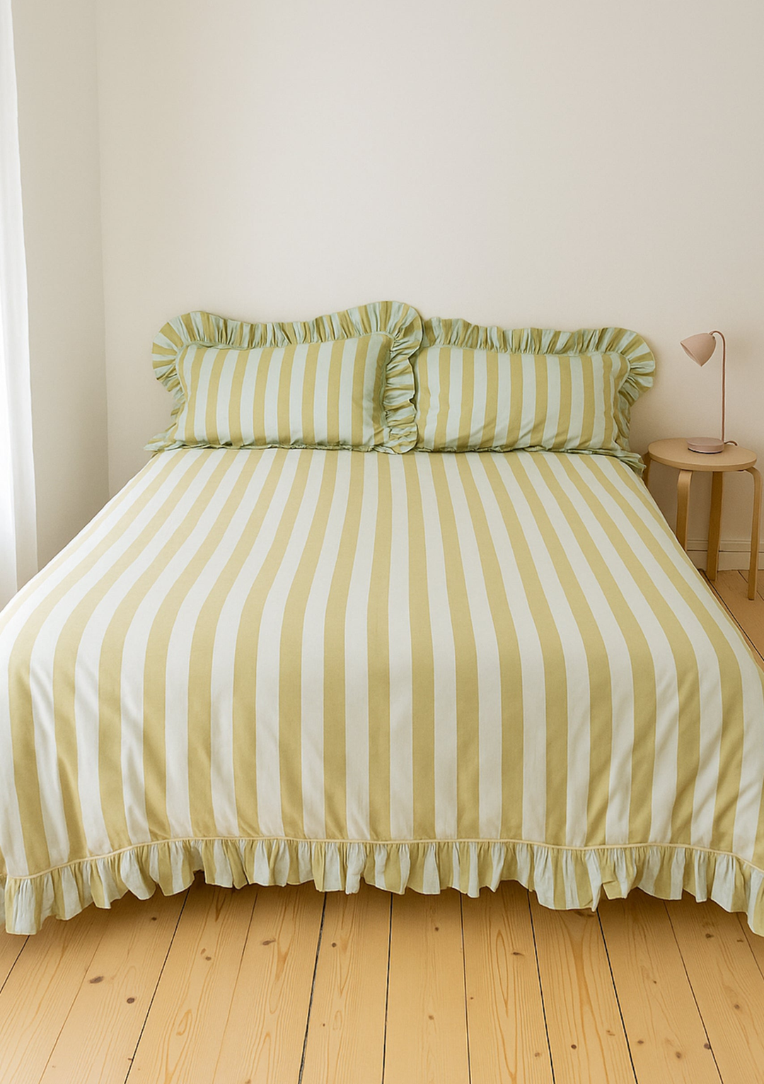 Cotton Duvet Cover & Pillowcases Set in Mint Stripe by TBCo with soft ruffled edges on pale wood floor background