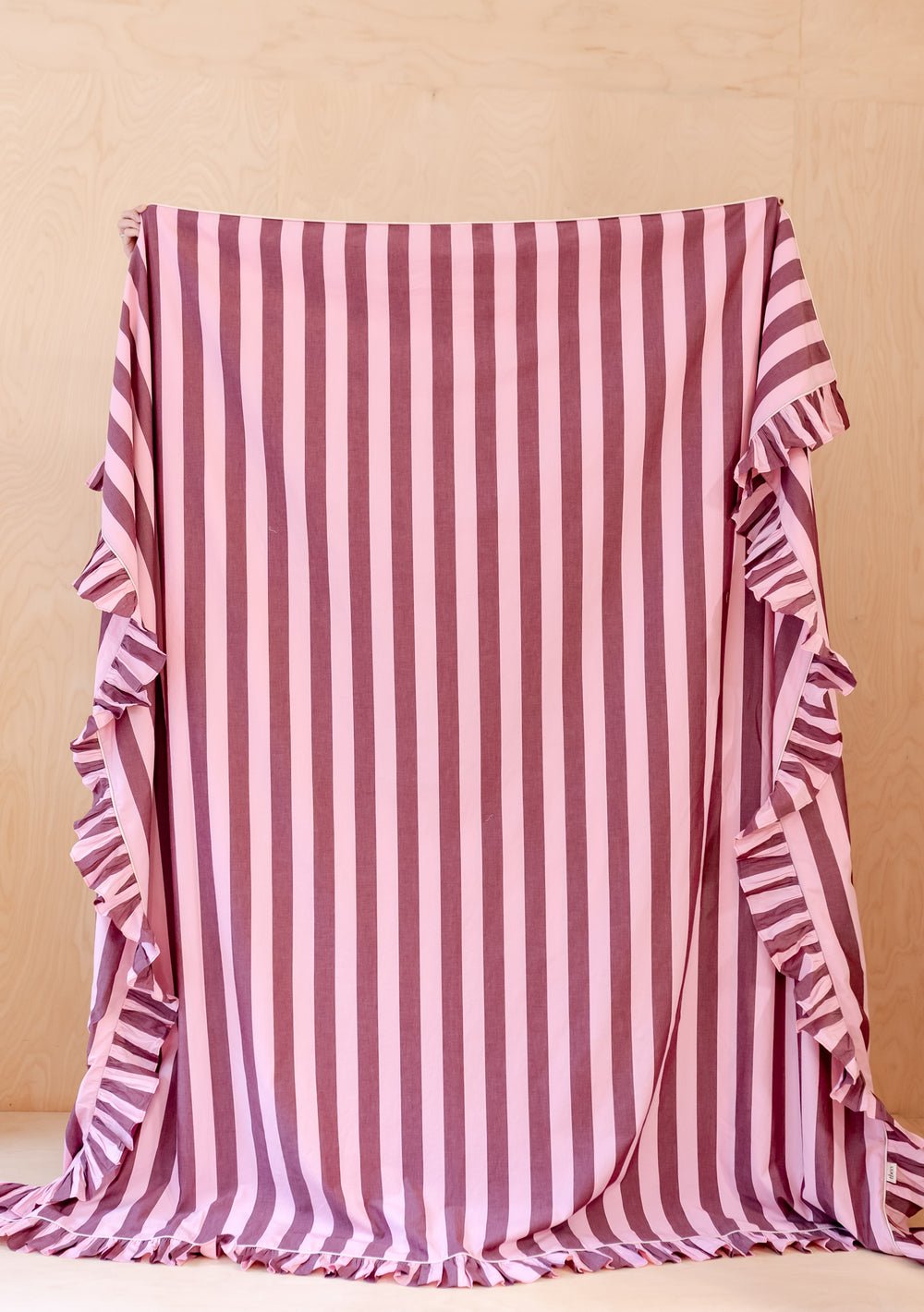 Cotton Duvet Cover & Pillowcases Set in Pink & Burgundy Stripe by TBCo, striped with delicate ruffle edges displayed fully.