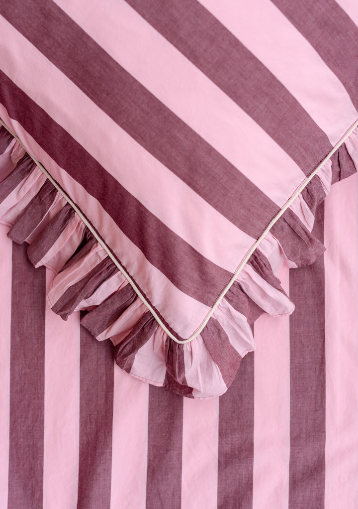 Close-up of TBCo Cotton Duvet Cover & Pillowcases Set in Pink & Burgundy Stripe showing ruffle edge detail and fabric texture