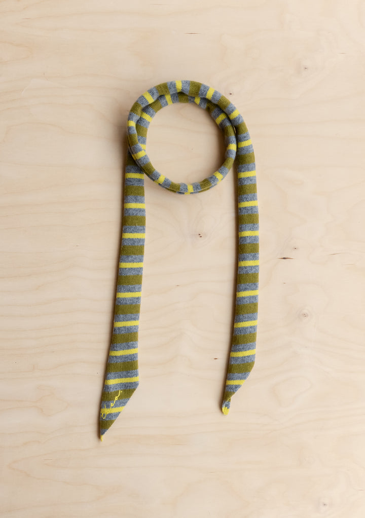 TBCo Merino Wool Neck Tie in Green Stripe scarf on a wooden background. 