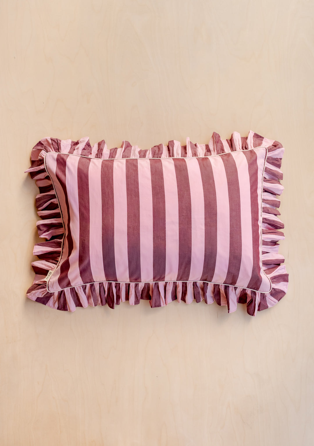 Pair of Cotton Pillowcases in Pink & Burgundy Stripe by TBCo, featuring ruffled edges and breathable poplin cotton fabric.