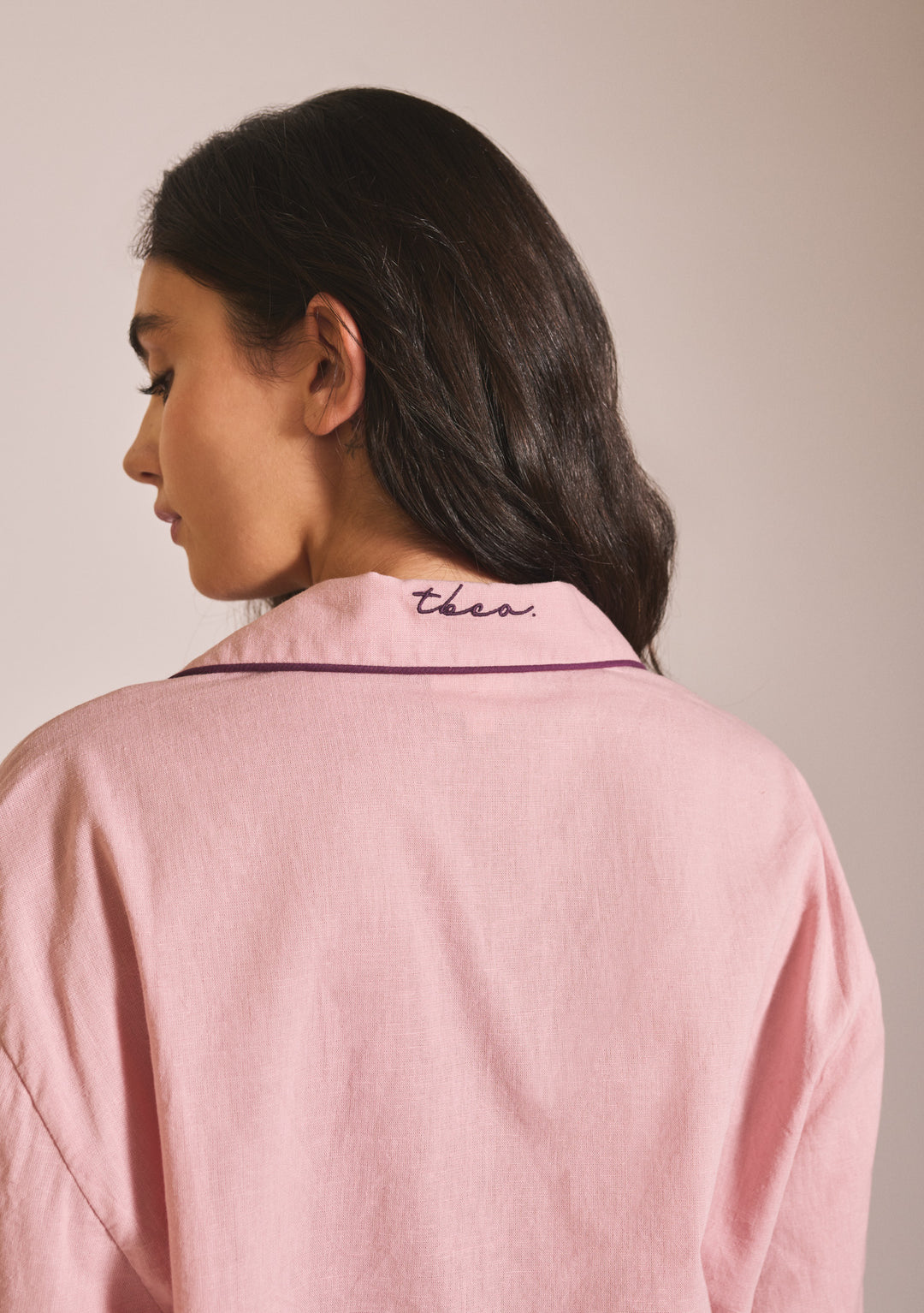 Portrait of model showing back collar detail of TBCo Cropped Cotton & Linen Pyjamas in Pink in gallery position 5