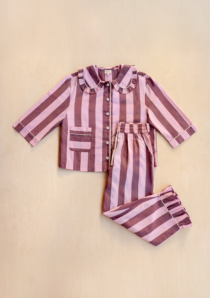 Cropped Cotton Pyjamas in Pink & Burgundy Stripe by TBCo laid flat, showing buttoned top with frill collar and elastic trousers