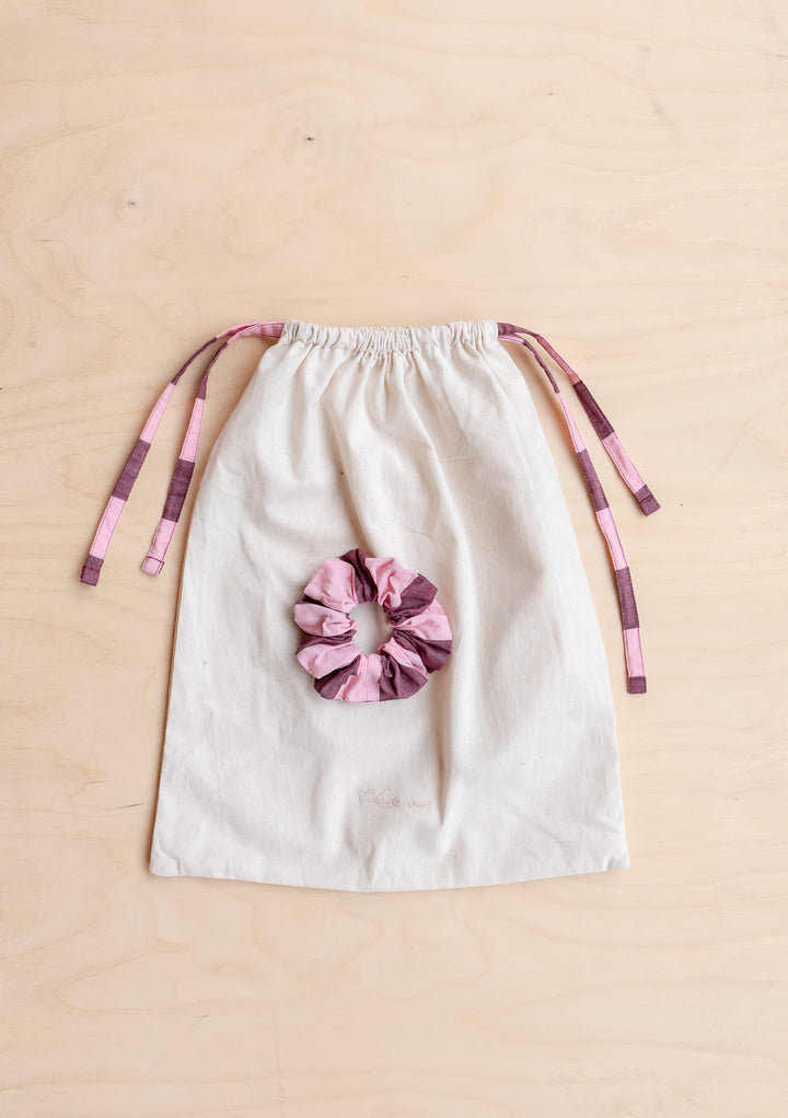 TBCo drawstring bag with burgundy and pink striped ties and matching scrunchie from Cropped Cotton Pyjamas in Pink & Burgundy Stripe