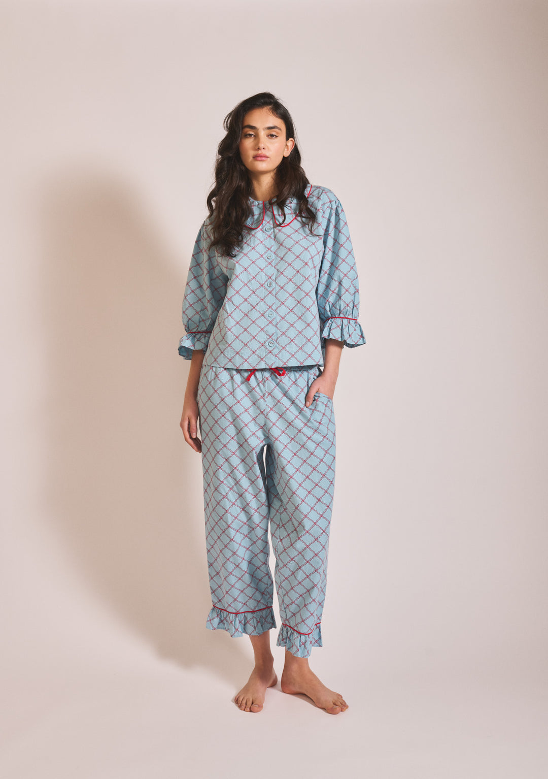 Model wearing TBCo Cropped Cotton Pyjamas in Blue Lattice, gallery image 3, 1442x2048 portrait view, relaxed pose