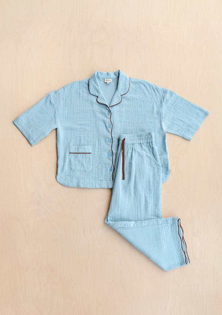 Cropped Cotton Pyjamas in Blue by TBCo, soft textured cotton with brown piping detail and comfortable drawstring waist.