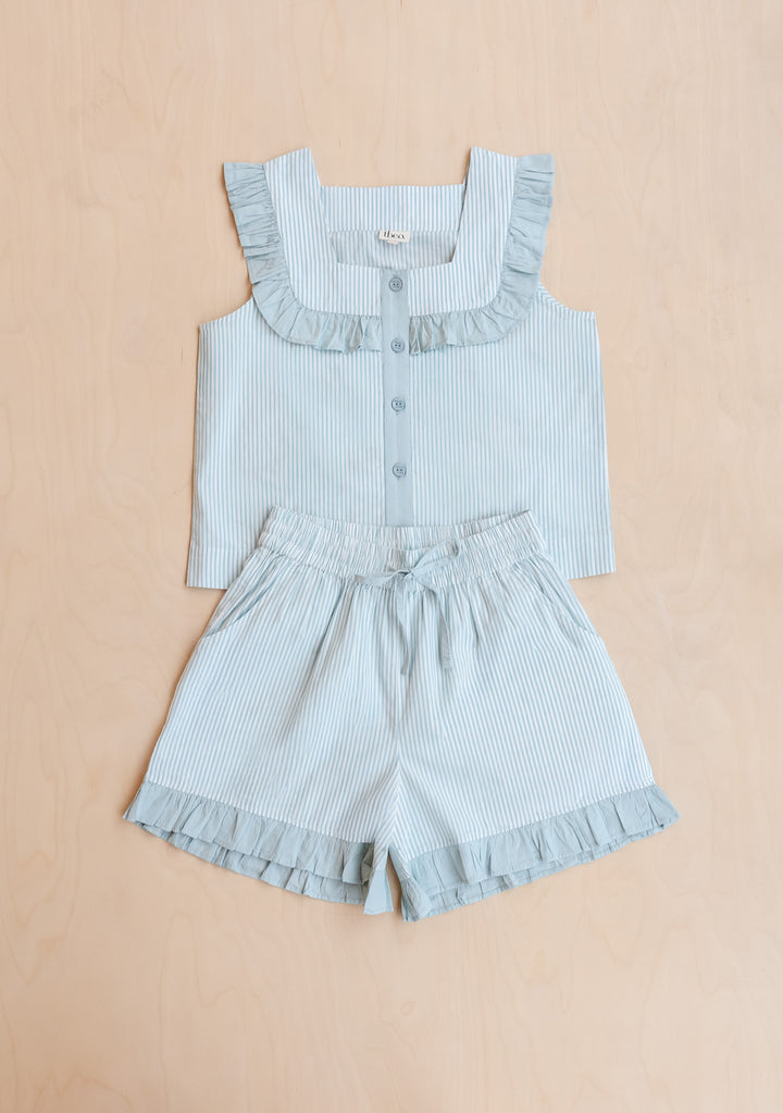Portrait image gallery position 7 showing TBCo Cotton Pyjamas in Blue Stripe Ruffle with sleeveless top and ruffle shorts