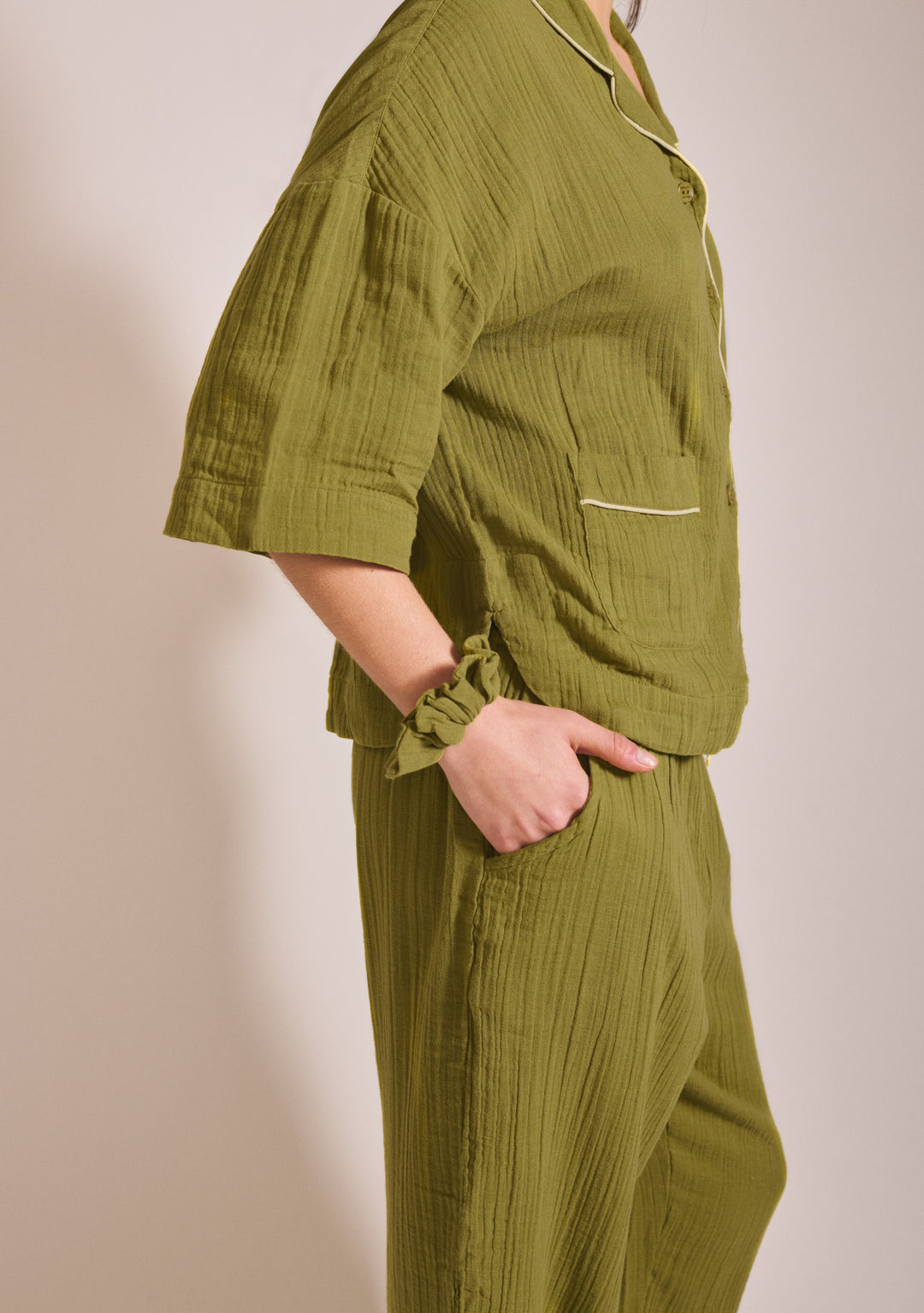 Side view of TBCo Cropped Cotton Pyjamas in Green with pockets and yellow piping gallery position 5 1442x2048 portrait