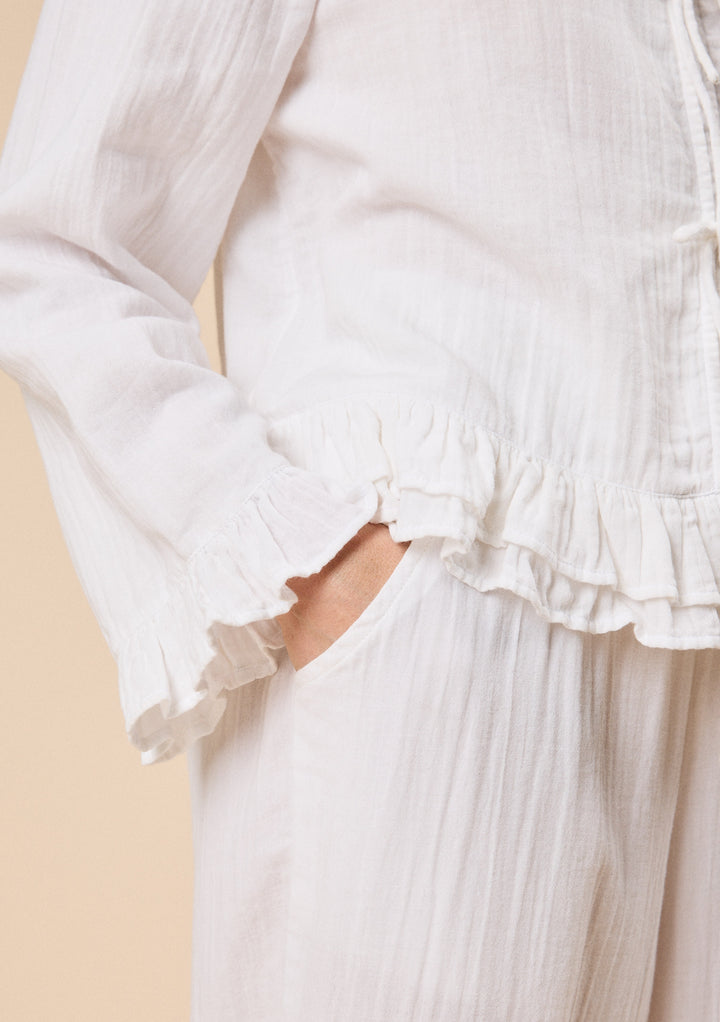 Close-up of TBCo Ankle Grazer Cotton Pyjamas in White Ruffle showcasing breathable natural and recycled fibres, Certified B-Corp, women-founded.