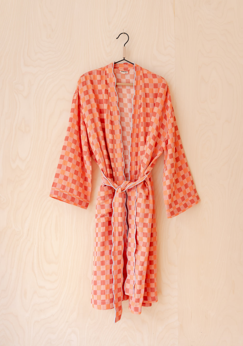 TBCo Cotton Robe in apricot checkerboard pattern, featuring scalloped edges and belt, displayed on wooden hanger