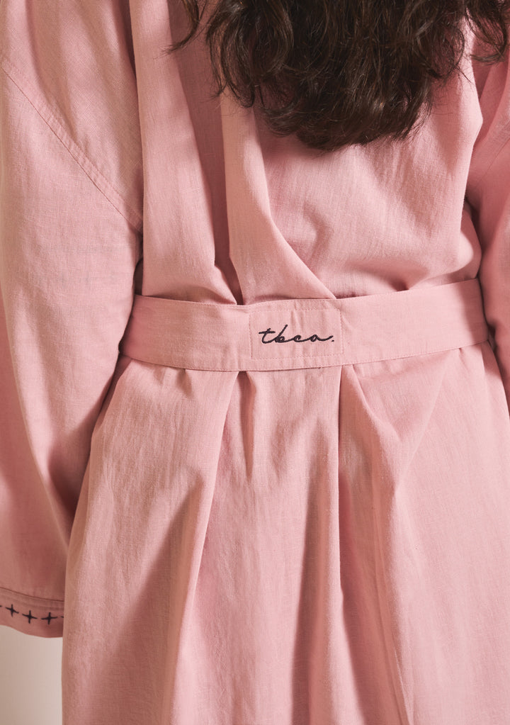 Close-up portrait of TBCo Cotton & Linen Robe in Pink showing sewn-in robe tie in gallery position 4