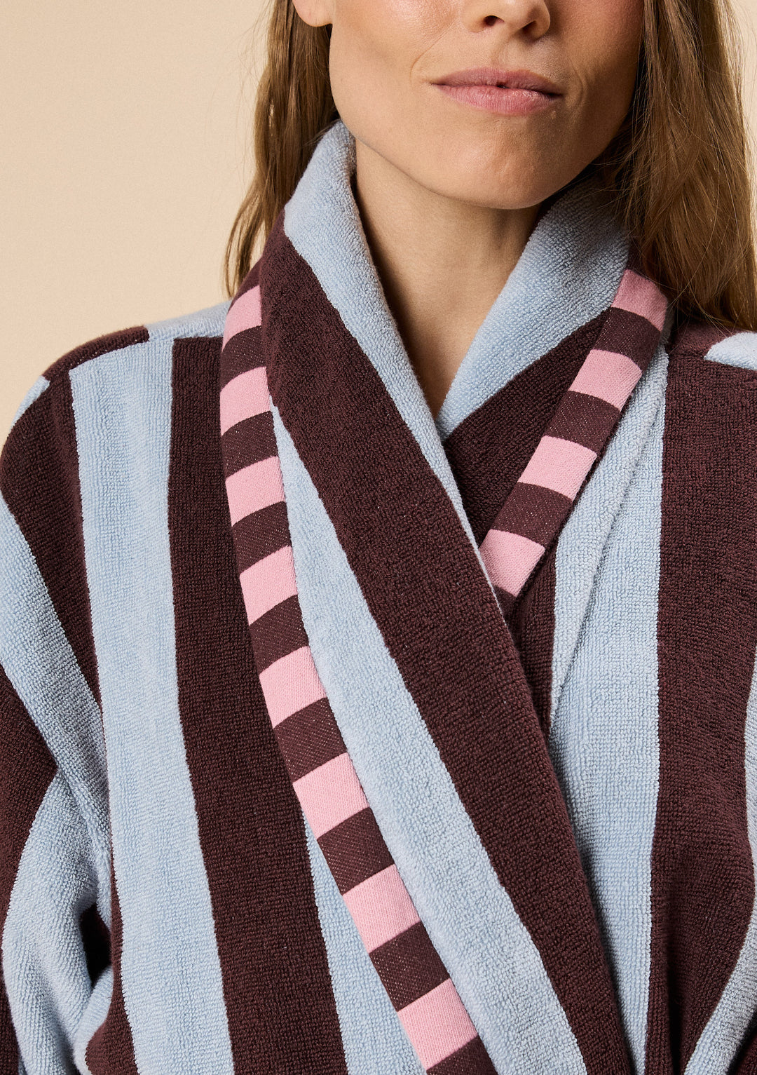 Close-up of TBCo Terry Cotton Bath Robe in Blue Stripe with plush fabric and contrasting pink and brown striped trim design