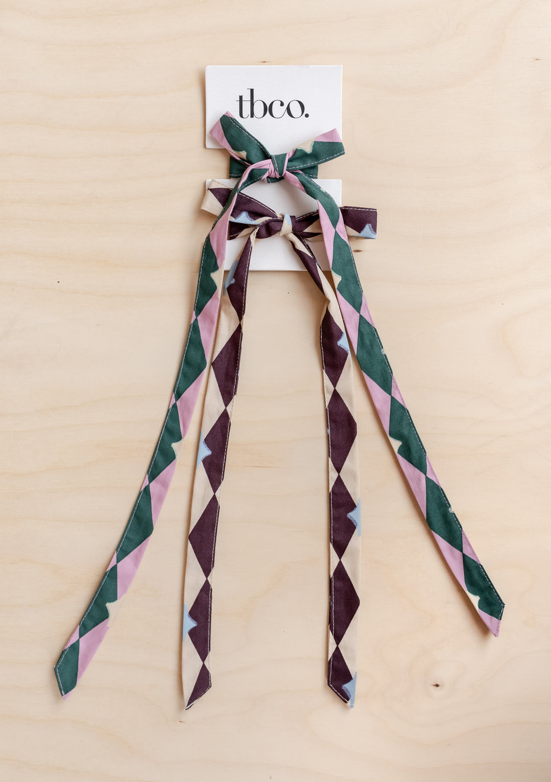 Cotton Bows Set of 2 in Harlequin from TBCo featuring playful pink green and cream geometric cotton ribbons