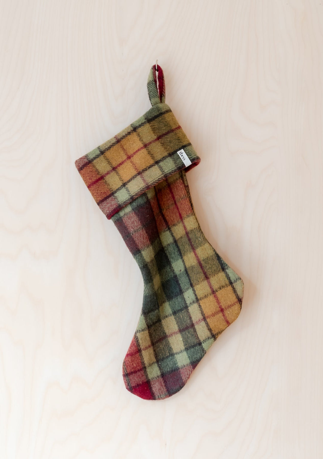 Recycled Wool Christmas Stocking in Buchanan Autumn Tartan by TBCo, featuring classic pattern and sustainable wool blend.