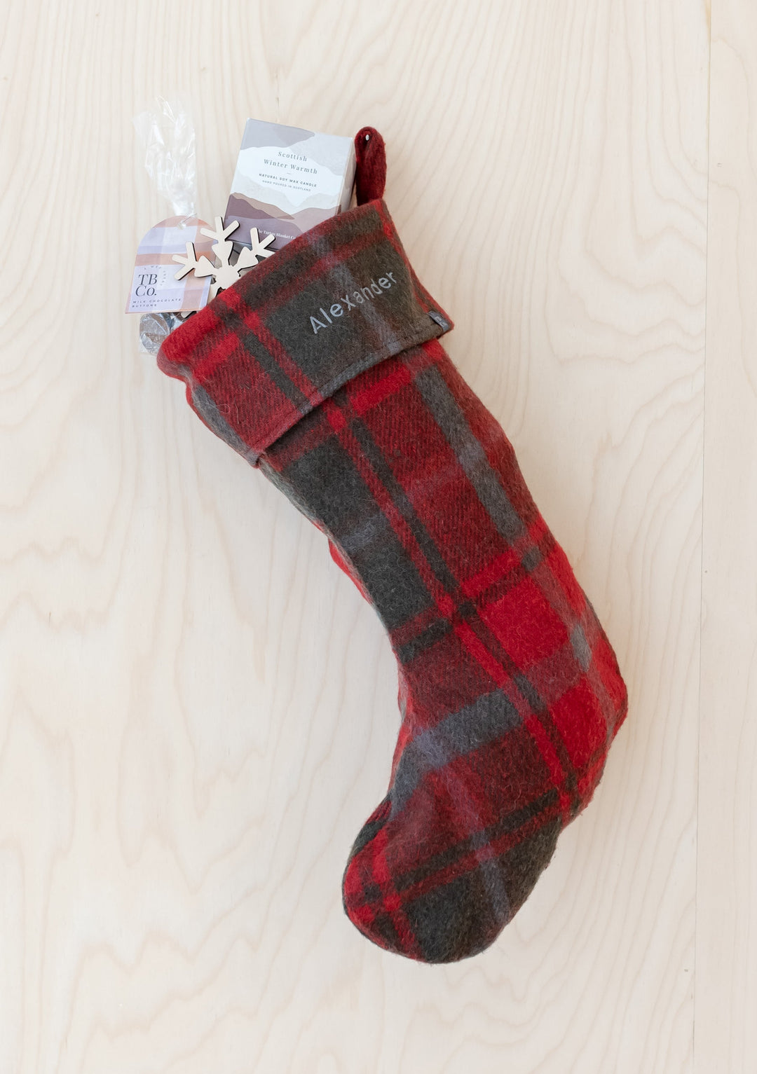 Recycled Wool Christmas Stocking in Dark Maple Tartan by TBCo with personalised embroidery and festive treats inside