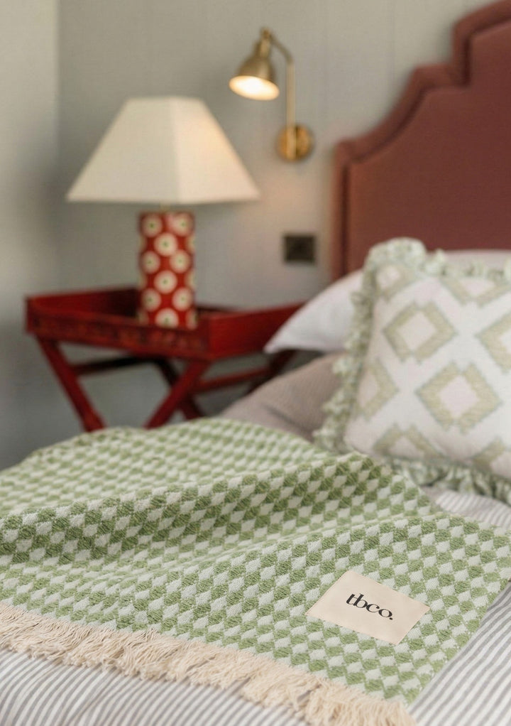 Cotton Throw in Green Argyle by TBCo with woven jacquard texture, natural and recycled fibres, Certified B-Corp, Women-Founded, designed to make an impact