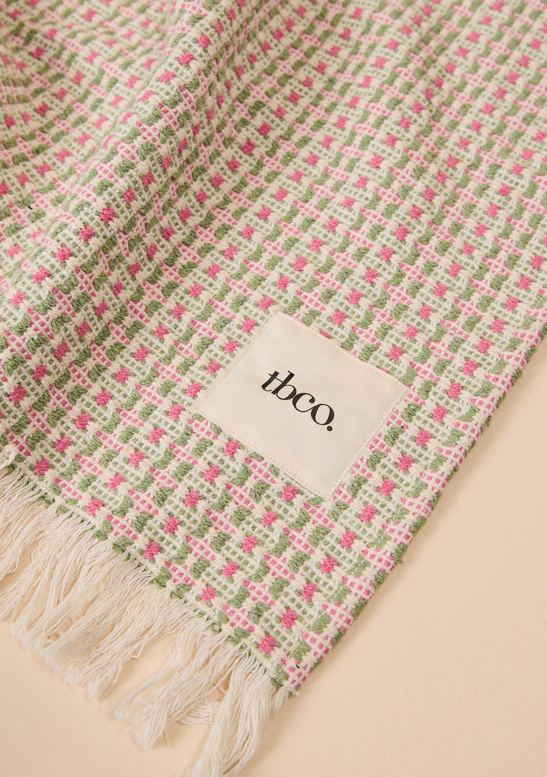 Cotton Throw in Rose Geometric by TBCo with woven jacquard design, natural and recycled fibres, Certified B-Corp, women-founded, designed to make an impact