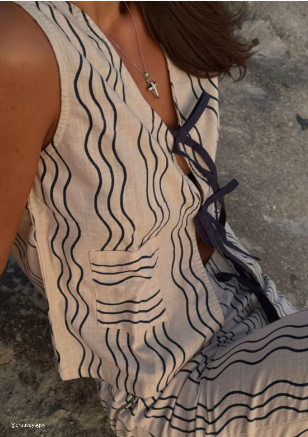 Sleeveless Cotton Tie Top in Blue Wave by TBCo with navy wavy stripes and contrast tie details in natural light setting