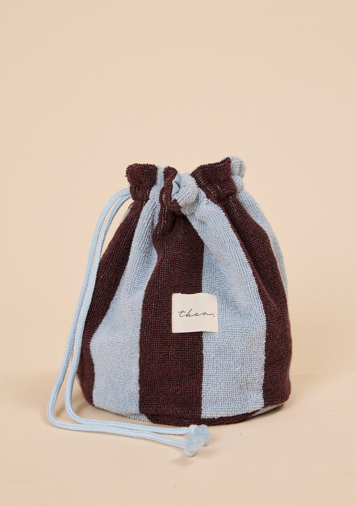 TBCo Terry Cotton Wash Bag in Blue Stripe with wide textured vertical sky blue and deep brown stripes and drawstring closure