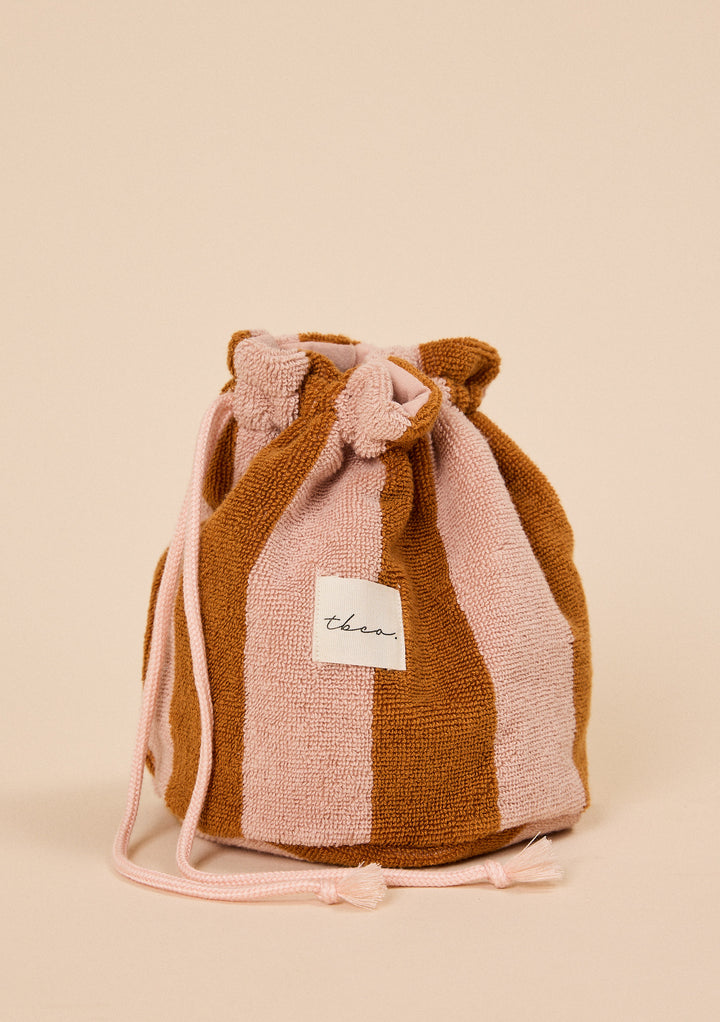 Soft textured TBCo Terry Cotton Wash Bag in Honeycomb Stripe with drawstring closure and alternating pink and brown panels